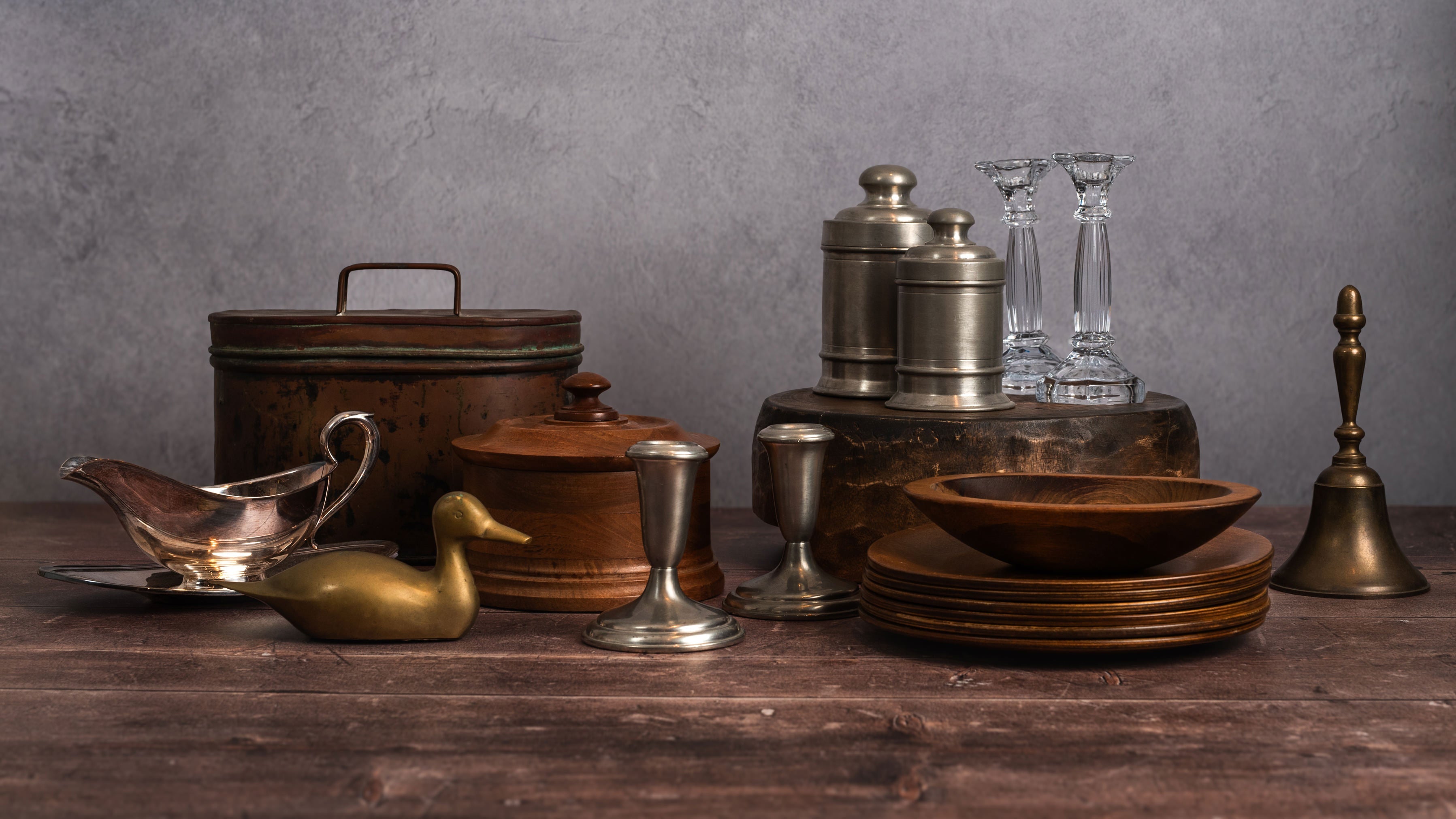 Collection of vintage items on a wood table with a white background at Addison West