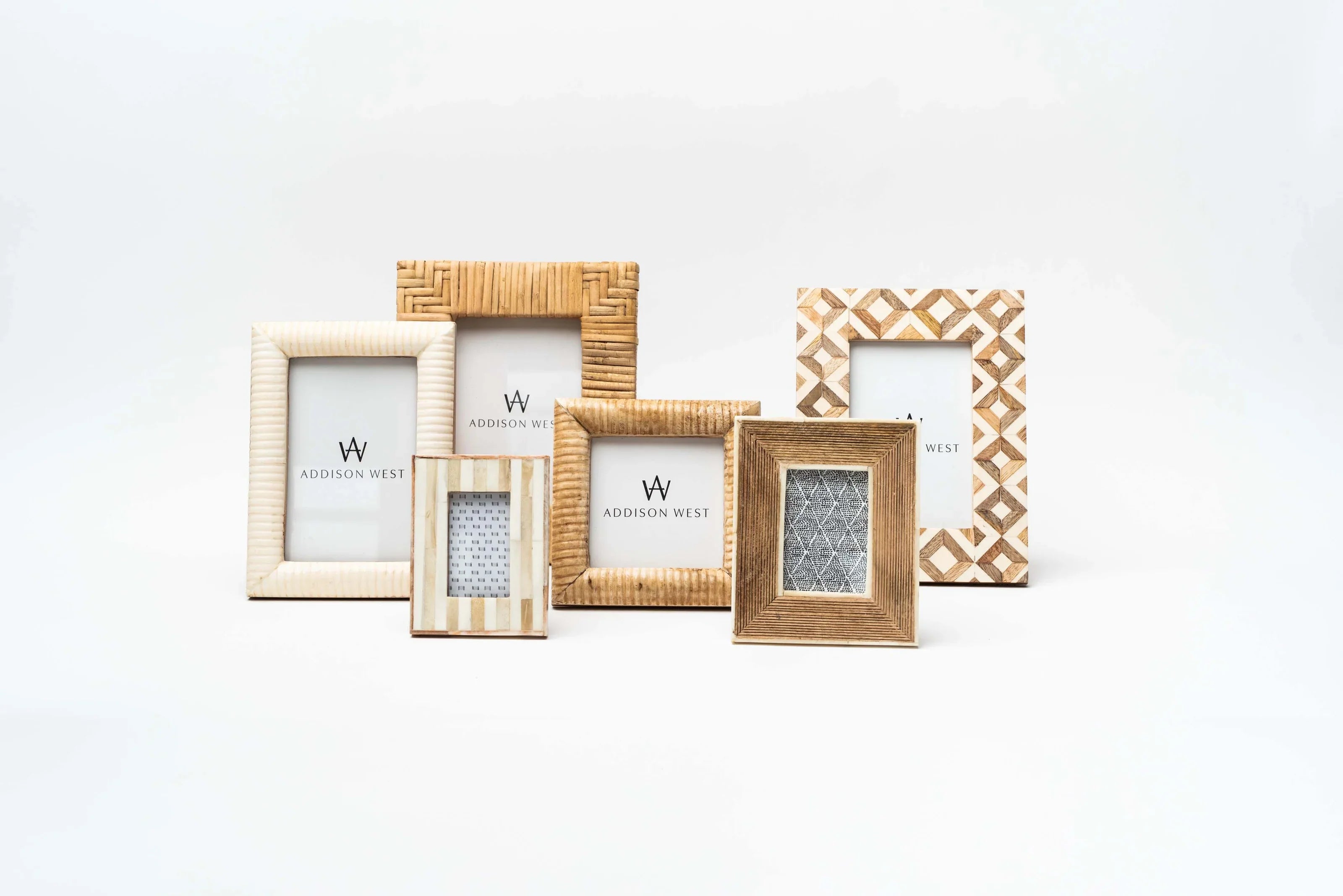 Collection of picture frames on a white background at Addison West