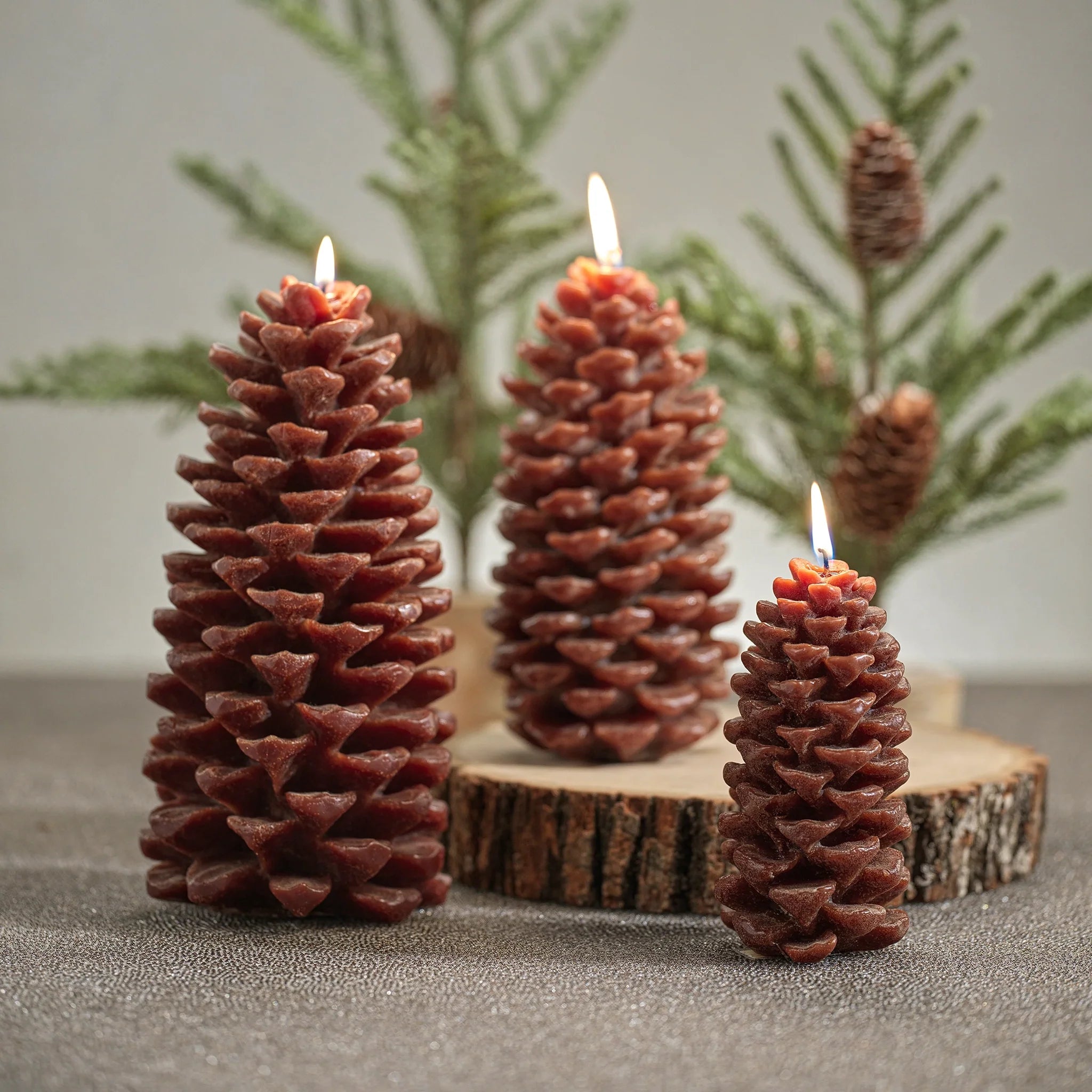 Three sizes of pinecone candle at Addison West