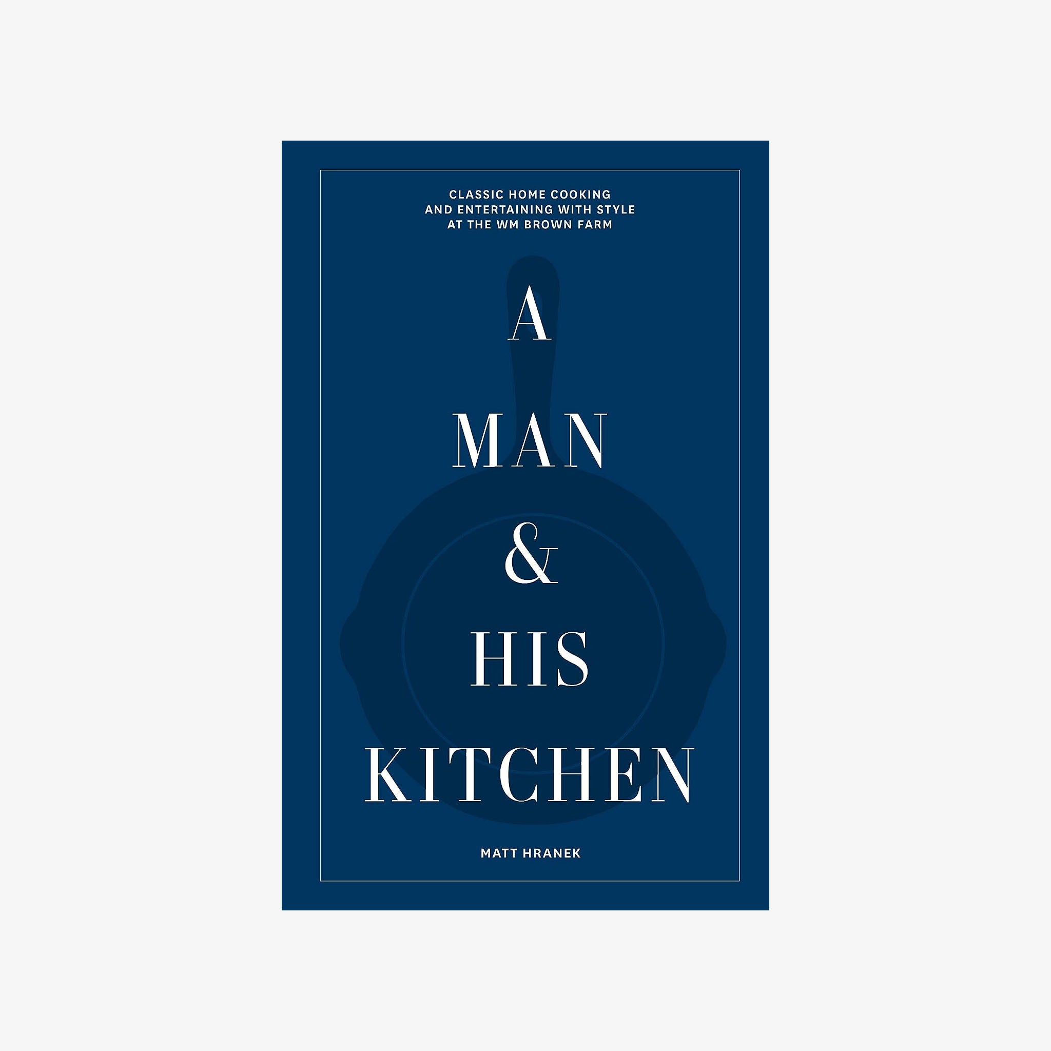 Blue front cover of book A Man & His Kitchen on a white background