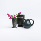 Forest Green Stoneware Pitcher and vases on a white background