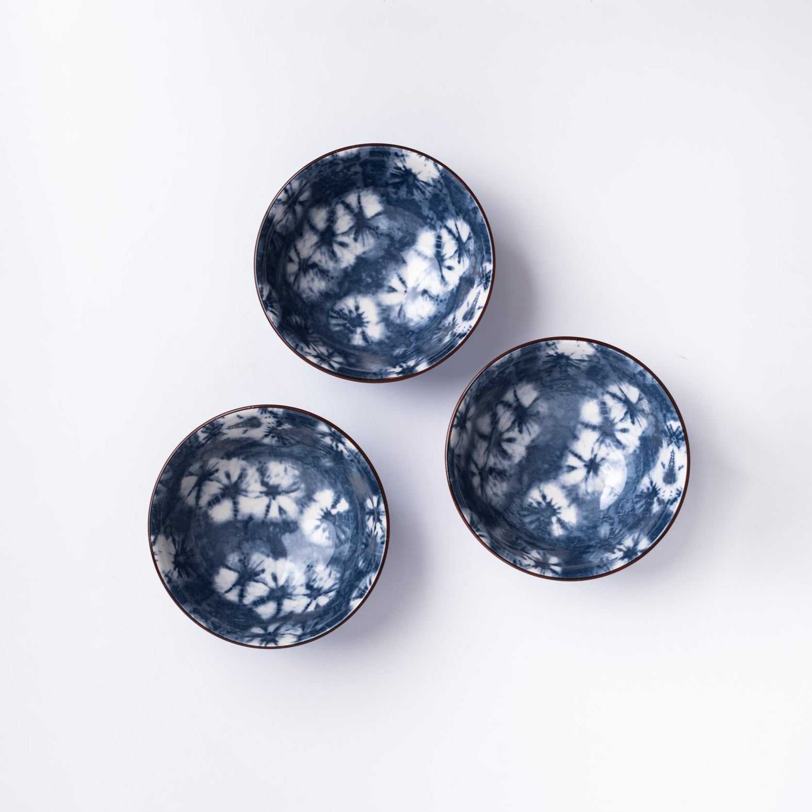 Small blue indigo bowl on a white background