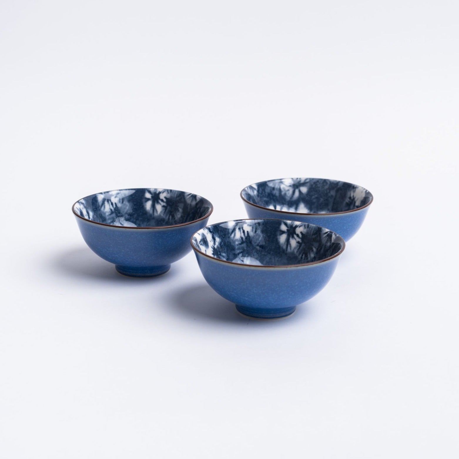 Small blue indigo bowl on a white background