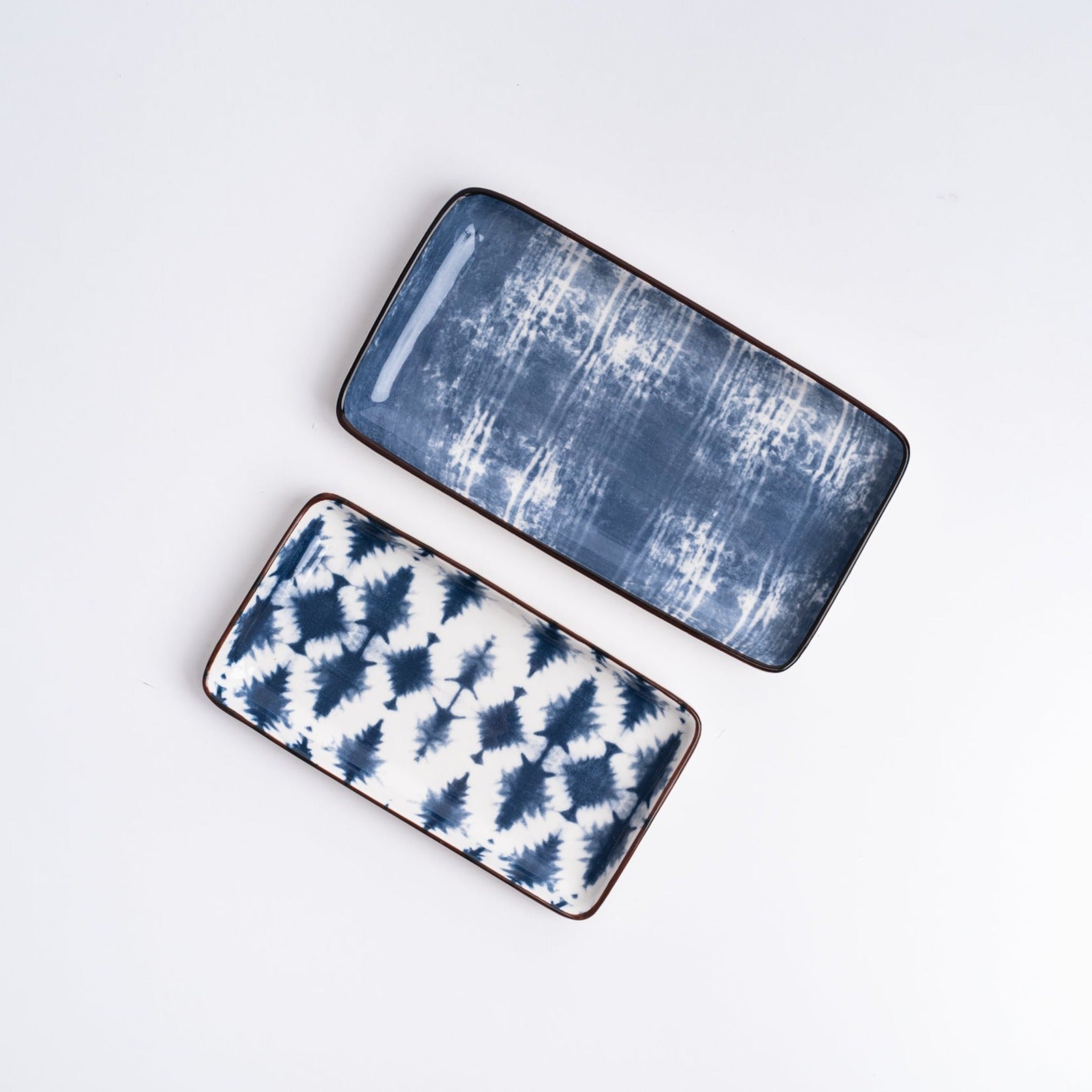 Batik White + Indigo Trays from above on a white background