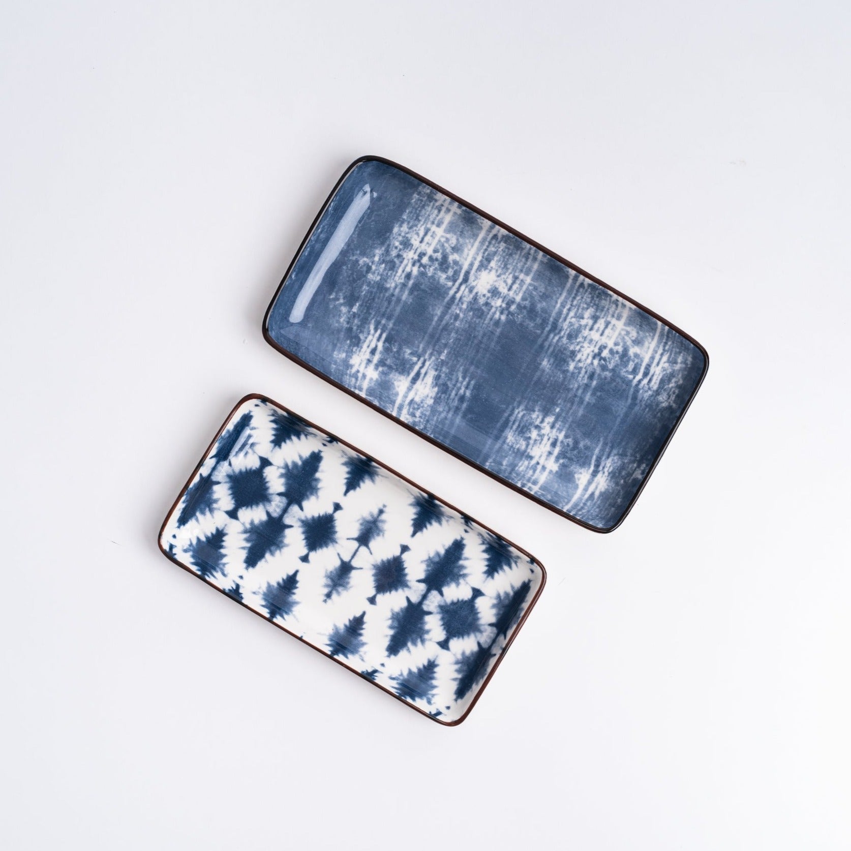 Batik White + Indigo Trays from above on a white background