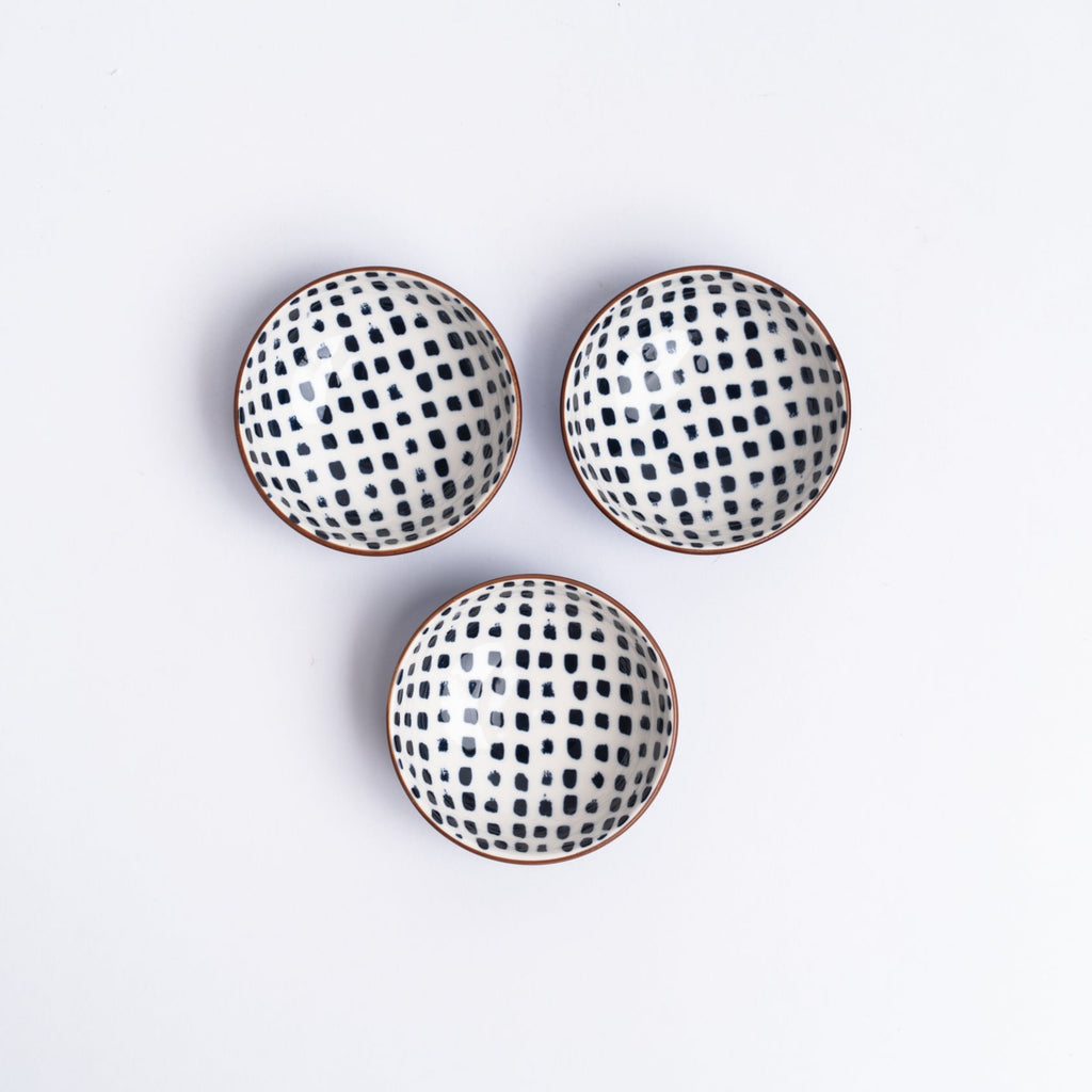 Small indigo bowls from above on a white background