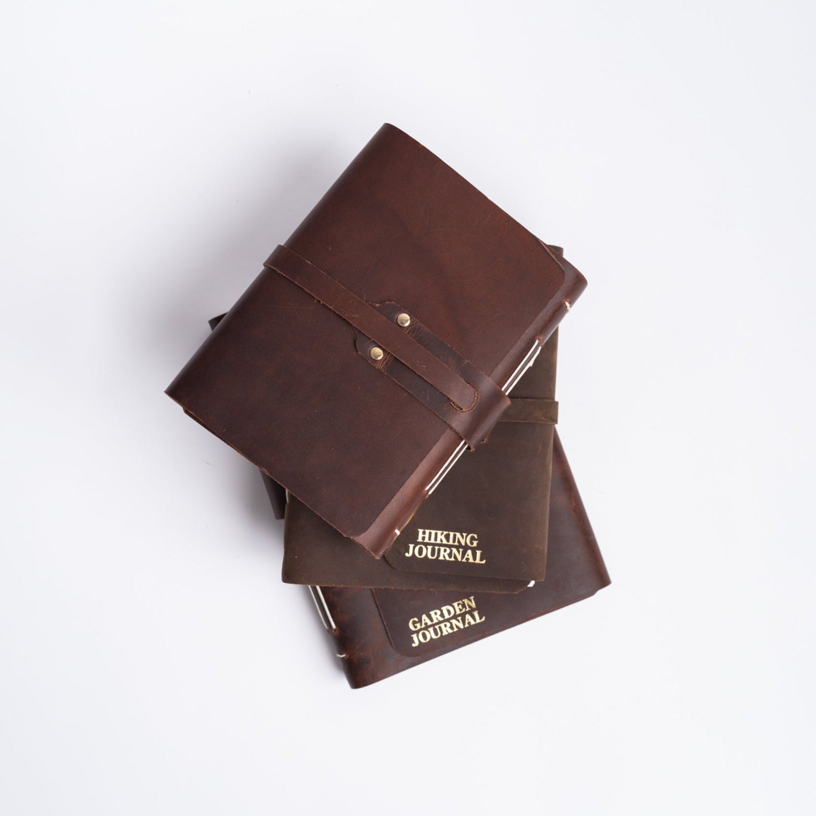 Handmade leather  journals with strap on white background