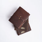 Handmade leather journals from above on white background