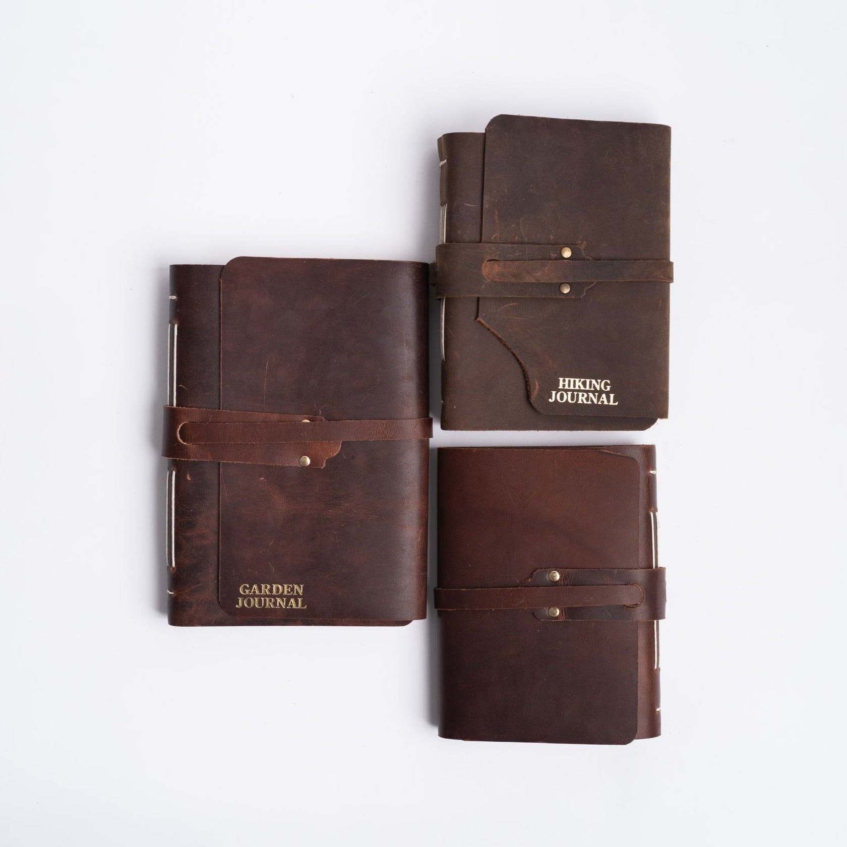 Vermont leather handmade journals from above on a white background