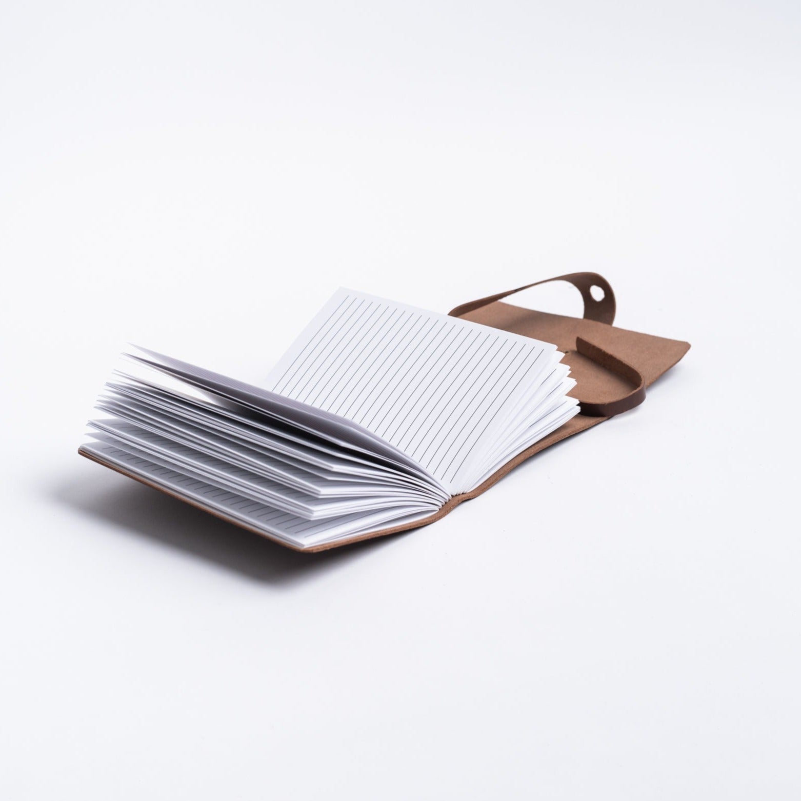 Vermont leather handmade journal from above with lined pages on a white background