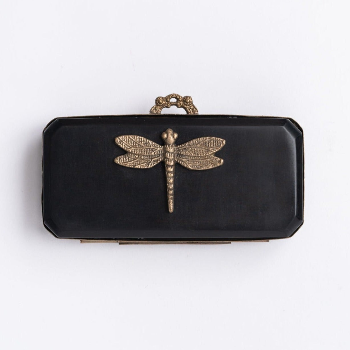 Small black dragonfly box with gold accents on a white background