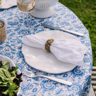 White Linen Napkin Set on a place setting on an outdoor dining table