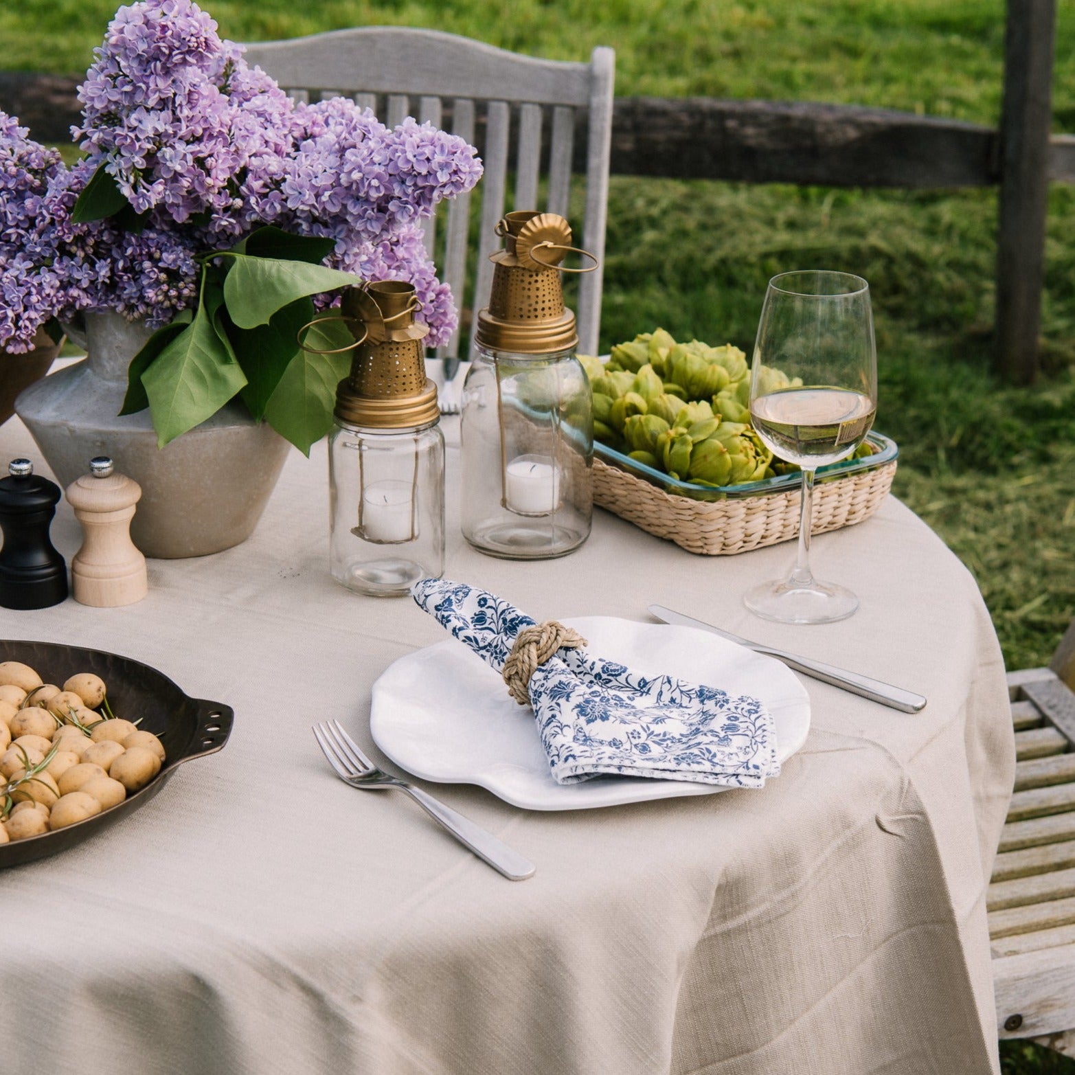 Beatriz Ball Havana 11" melamine white Dinner Plate on an outdoor dining table