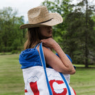 Model wearing Brixton Houston Cowboy Hat in Natural with a black tank top in a field