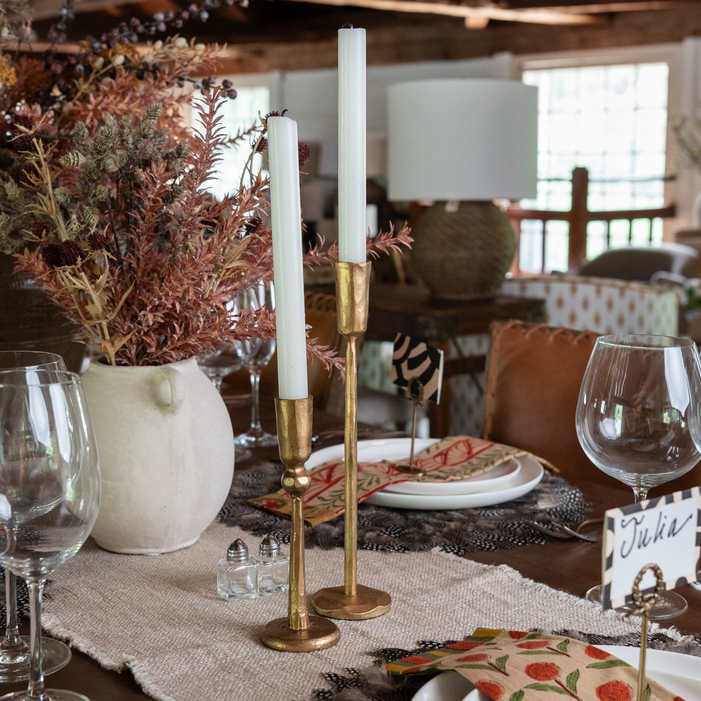 Gold Legacy Forged Candlesticks on a festive dinner table