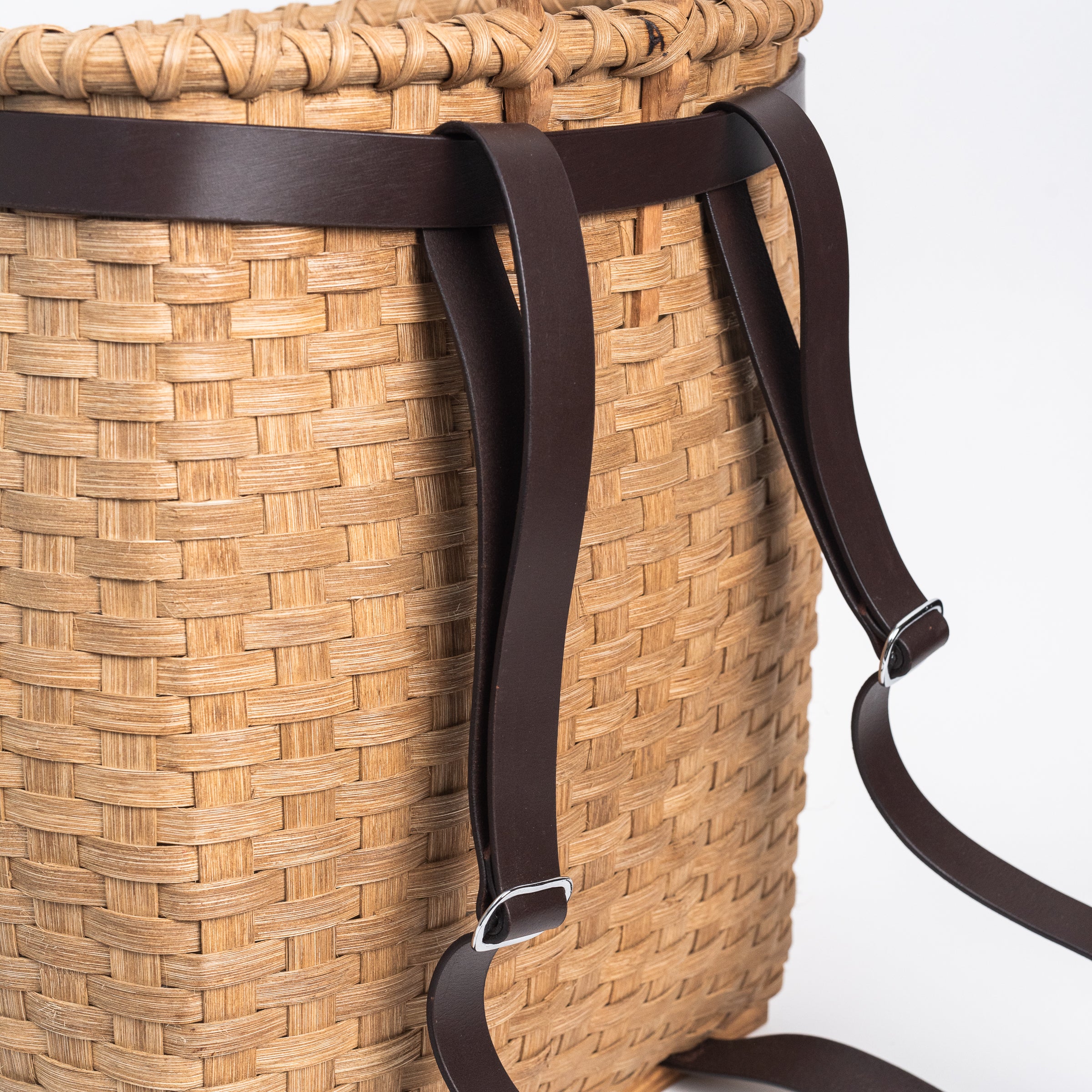 Close up of Handmade Vermont Pack Basket on a white background