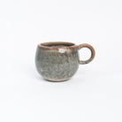 Wrap Your Hands Around Me Mug in brown on a white background