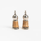 Metal and rattan salt and pepper set with decorative finial at top on a white background by enchanted home