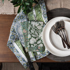 Vermont Handmade Napkins in Teal on a dining table with plates and foliage at Addison West