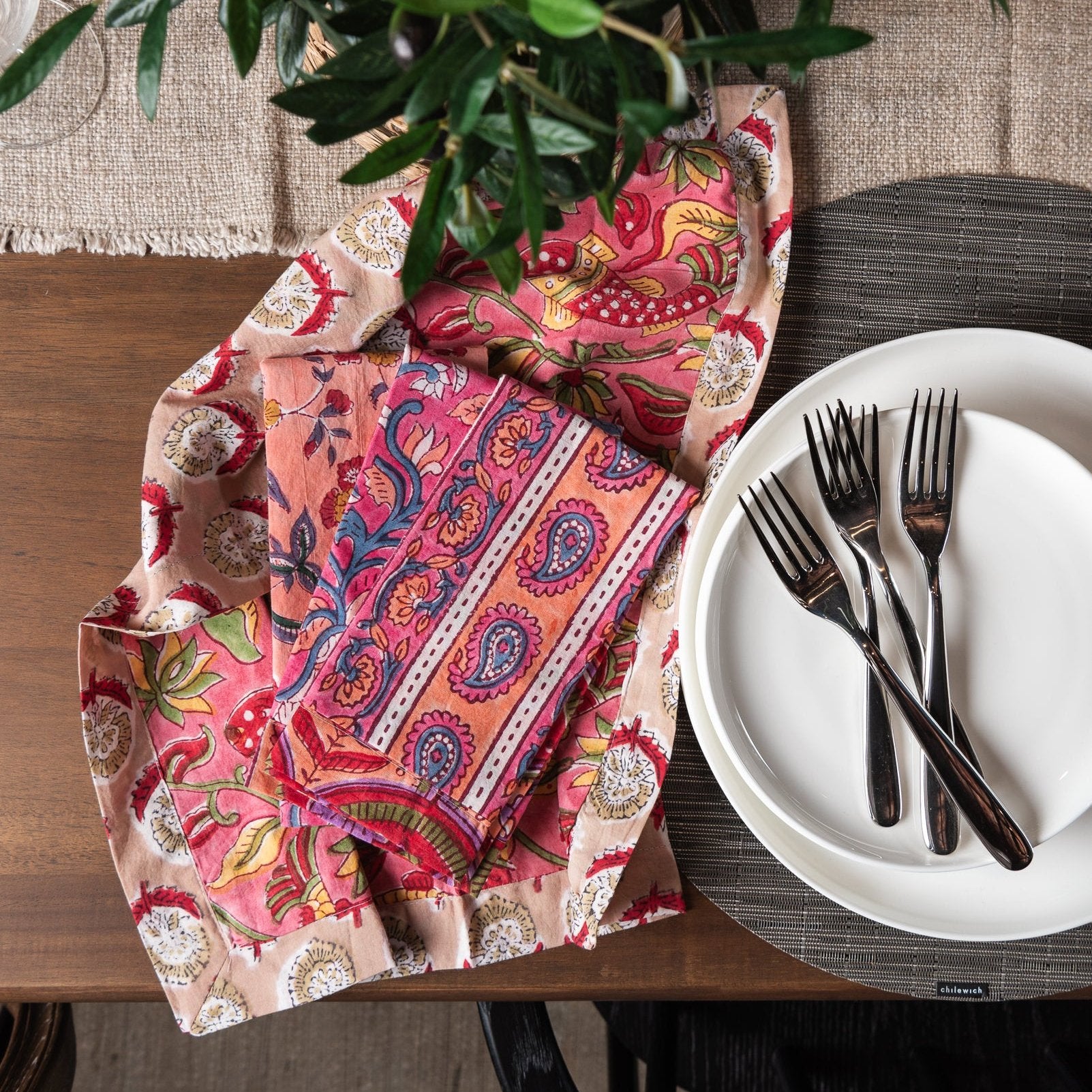 Vermont Handmade Napkins in Pink Mango on a dining table at Addison West