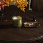 Lafco Sage + Walnut Signature Candle on a dark wood table at Addison West