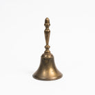 Vintage Brass Bell on a white background at Addison West