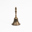 Vintage Brass Bell on a white background at Addison West