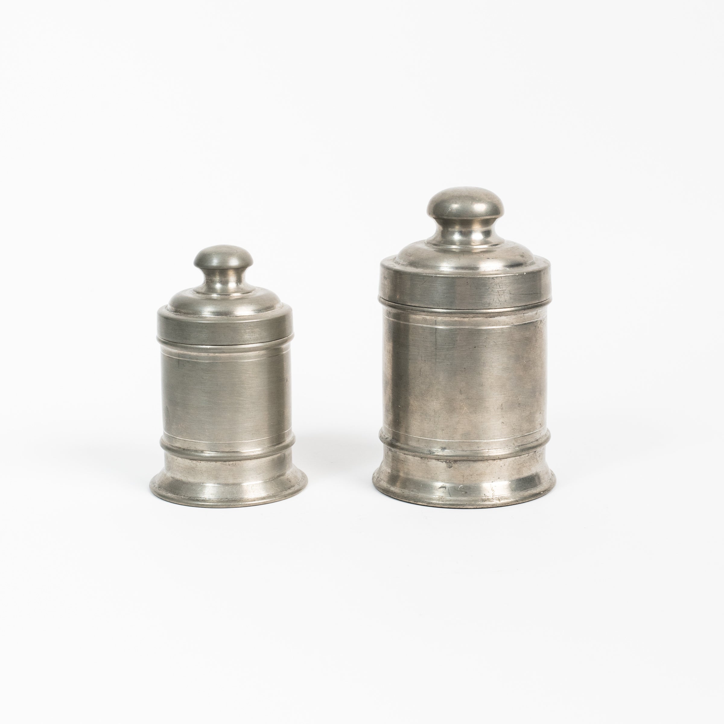 Set of Vintage Pewter Apothecary Jars on a white background at Addison West