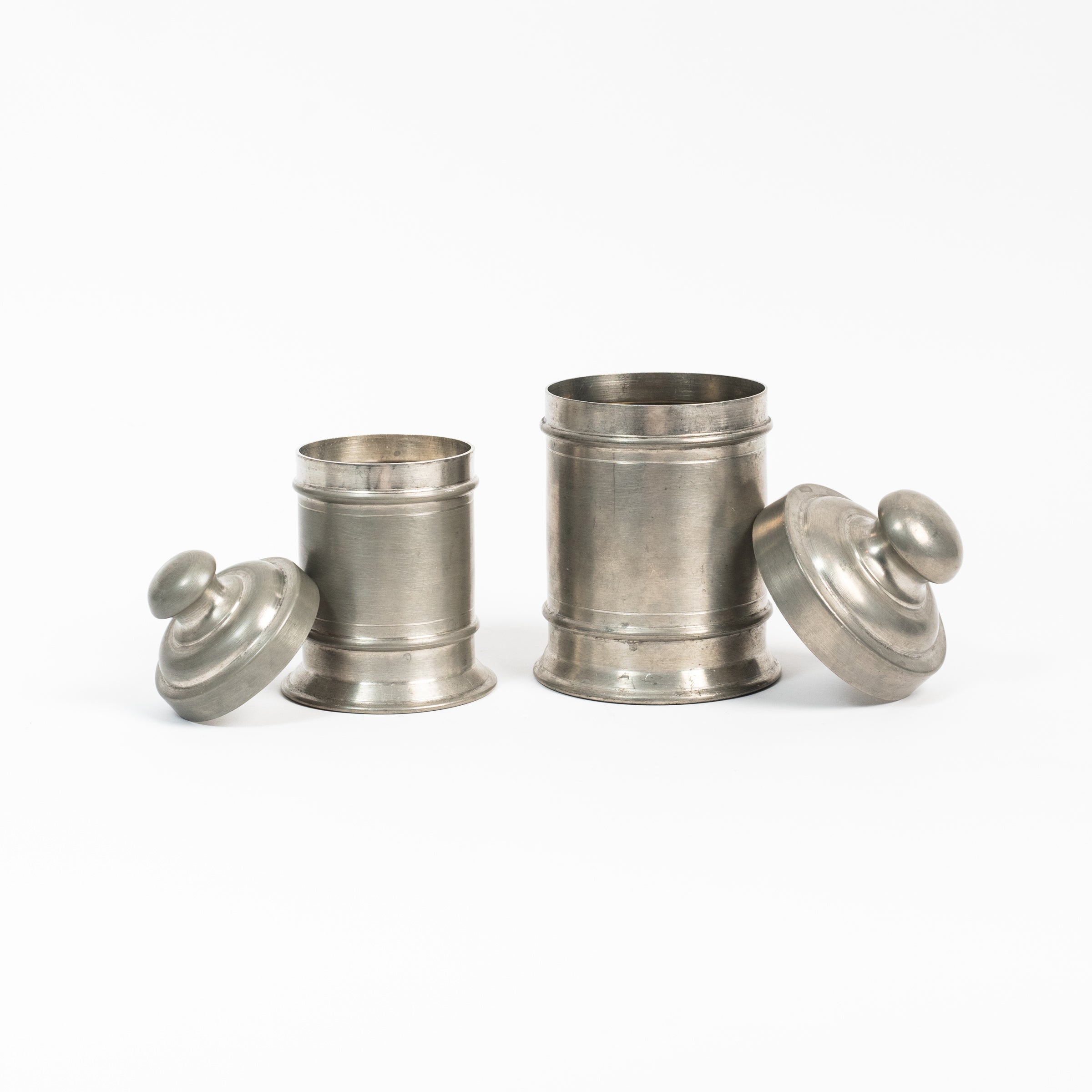 Set of Vintage Pewter Apothecary Jars on a white background at Addison West