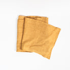 Linen Table Runner in Mustard Yellow on a white background at Addison West