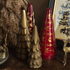 Brass trees and Deck The Halls Glass Tree styled on a shelf at Addison West