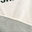 Close up of Town Pride Ski VT Sweater in Green on a white background at Addison West