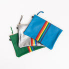 Rainbow Carter Leather Clutches on a white background at Addison West