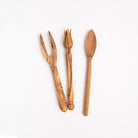 Olive Wood Olive Pick, fork, and spoon on a white background at Addison West