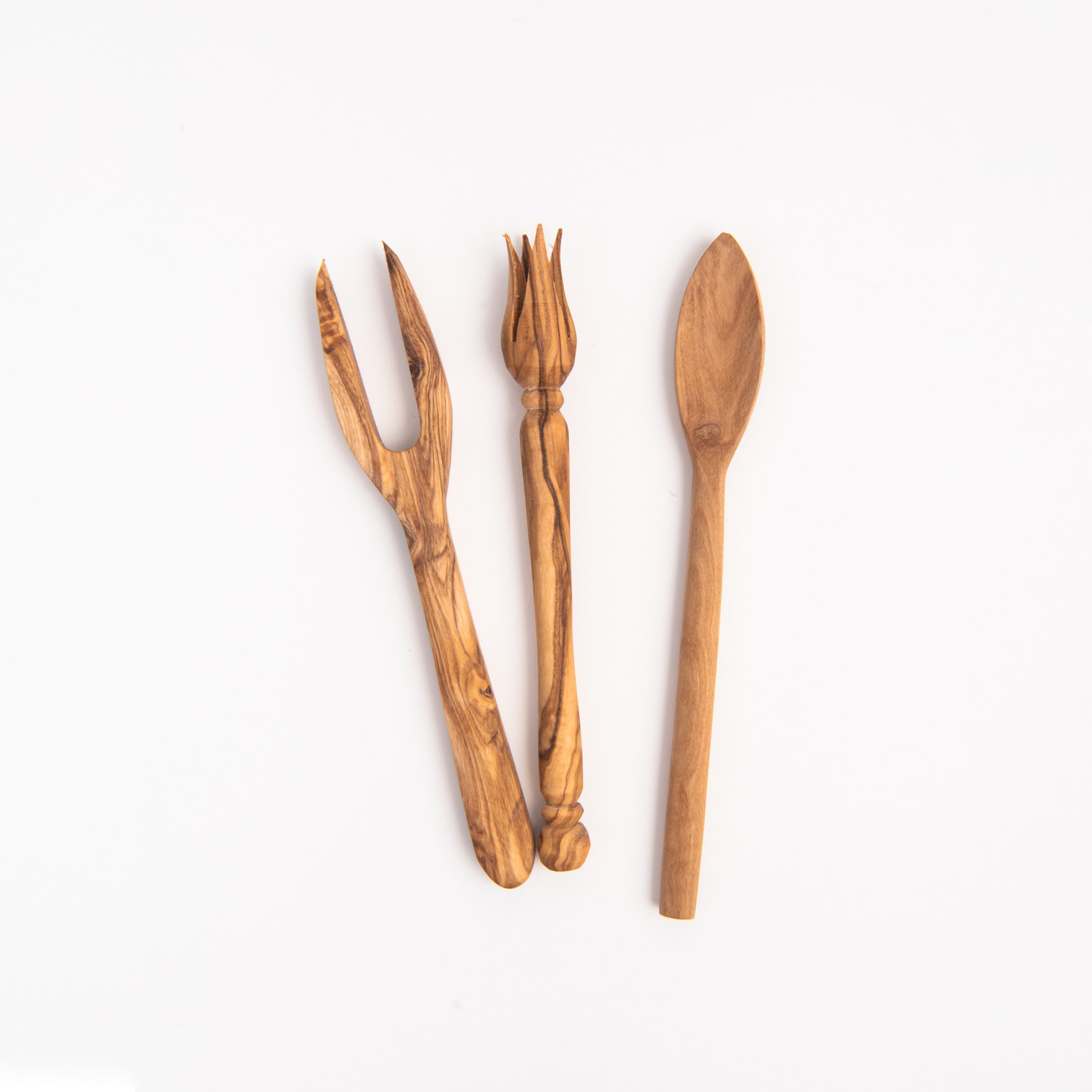 Olive Wood Olive Pick, fork, and spoon on a white background at Addison West