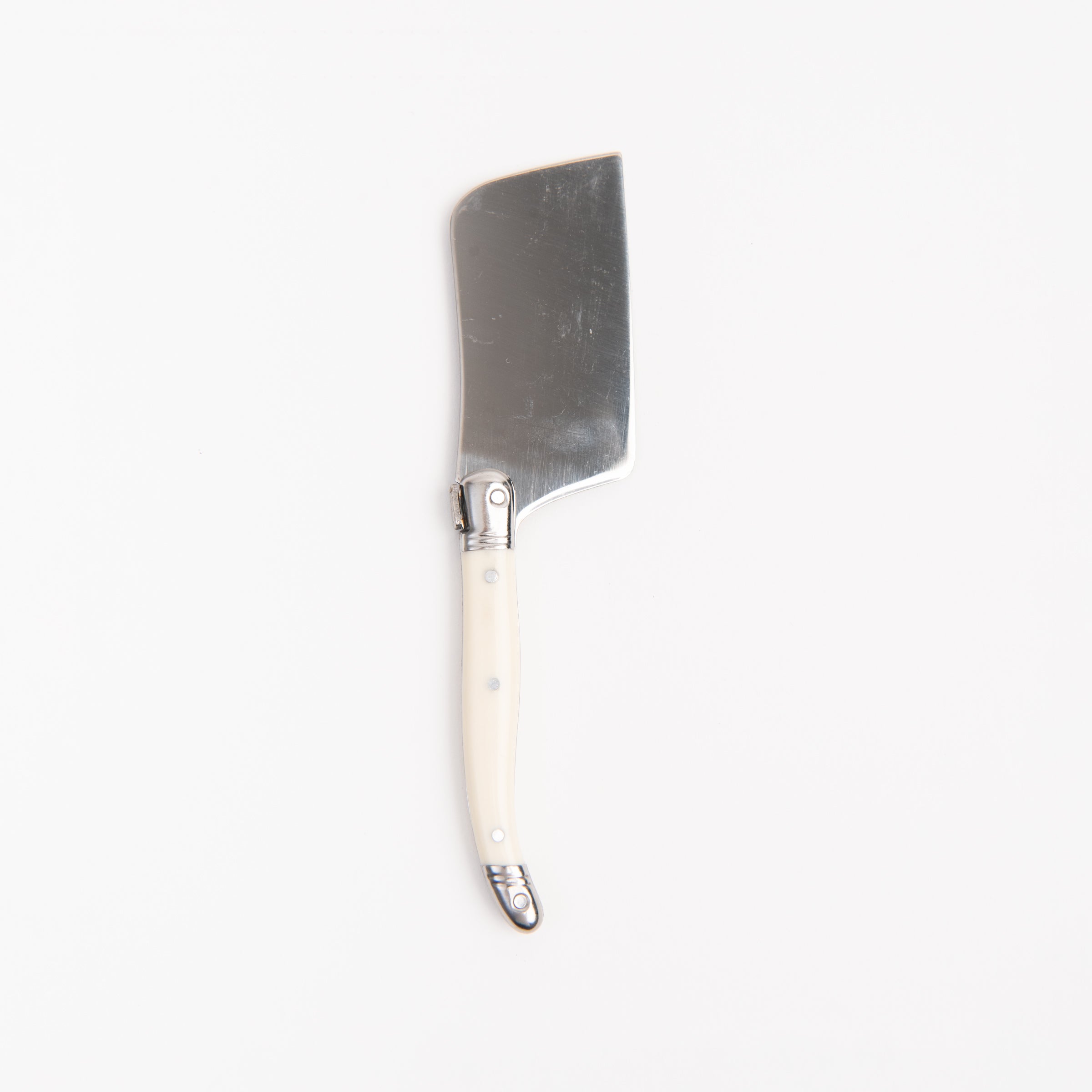 Laguiole Ivory Mini Cheese Cutter on a white background at Addison West