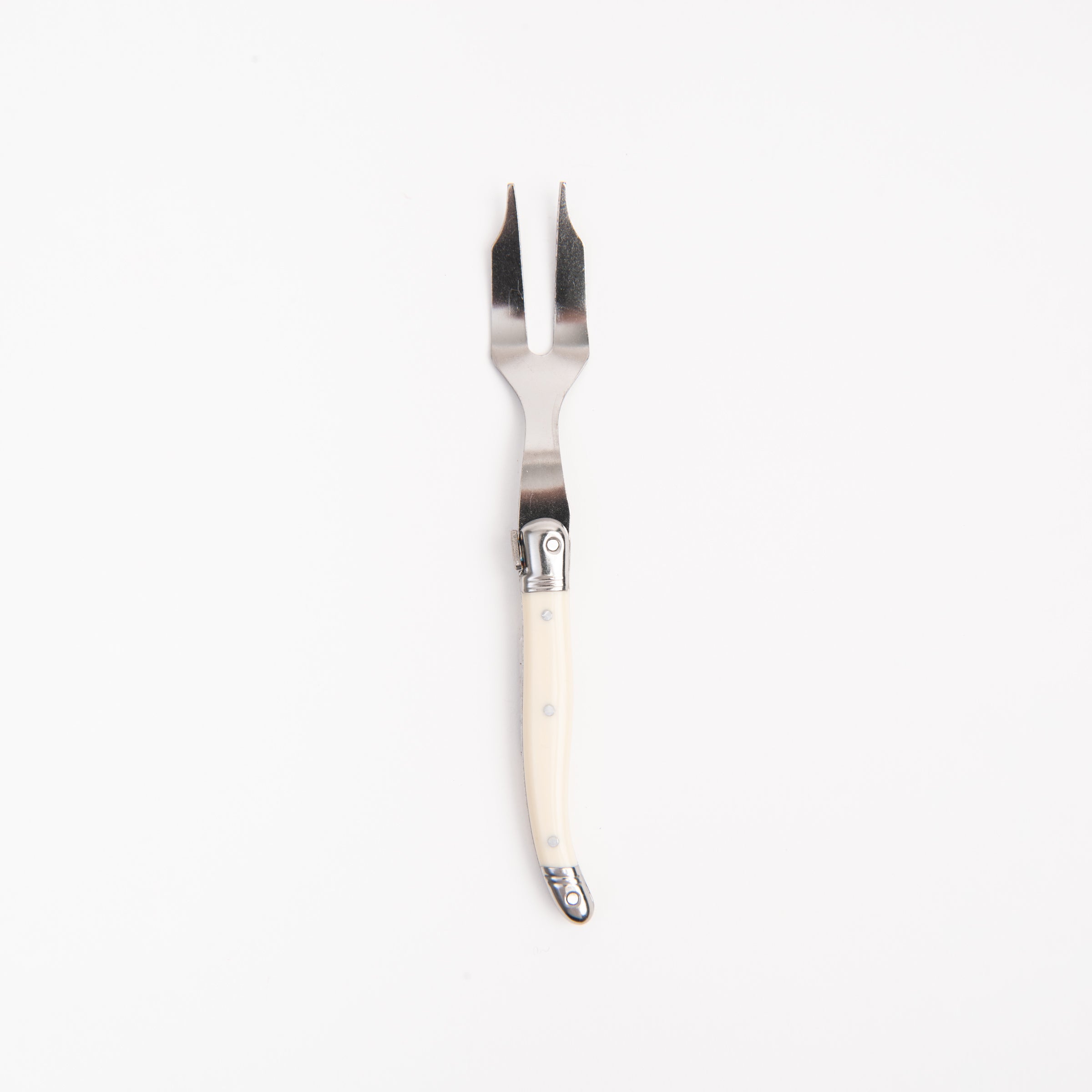 Laguiole Ivory Mini Cheese Fork on a white background at Addison West