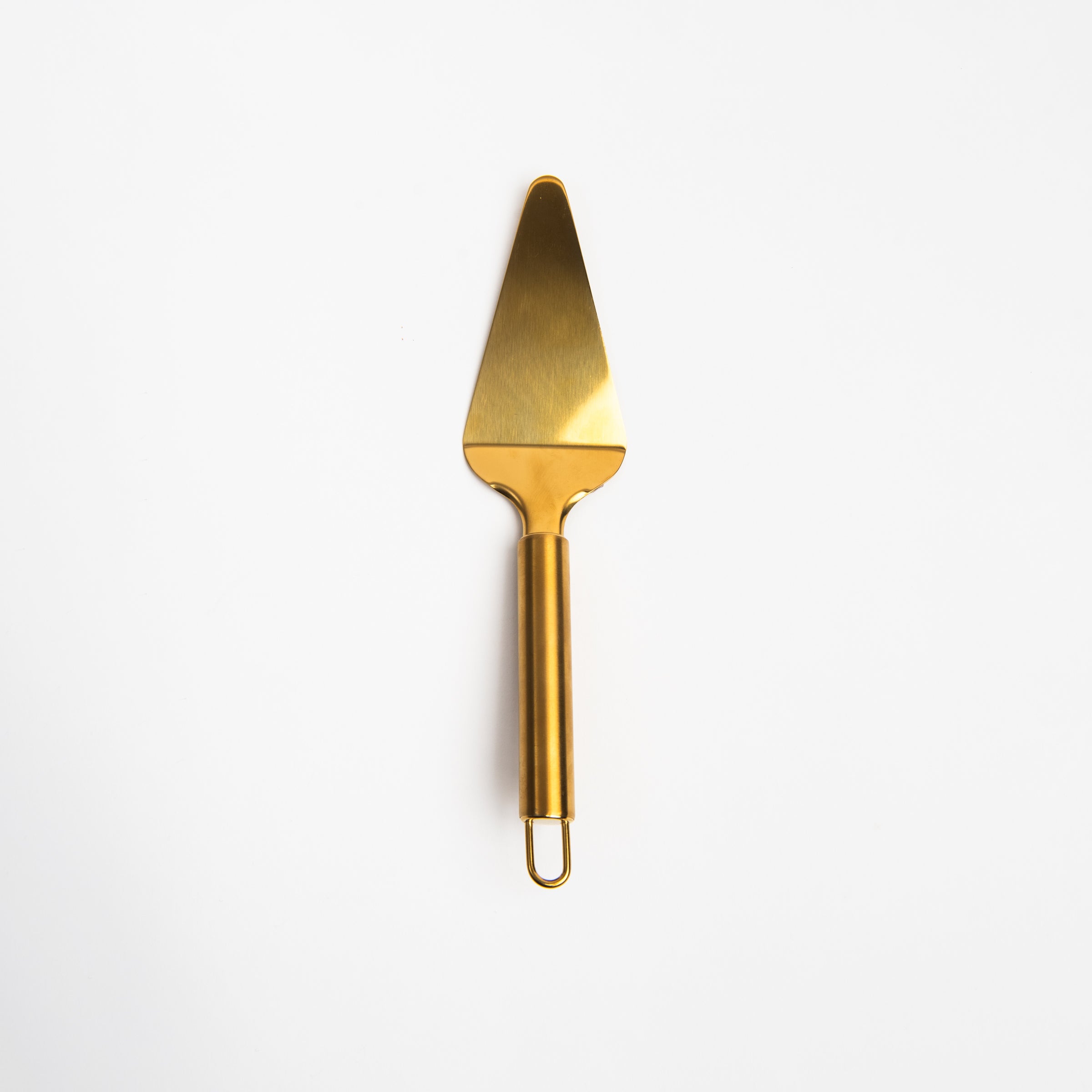 Brass finish Cake Server on a white background at Addison West