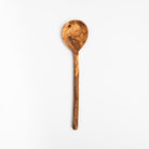 Olive wood spoon with large round head on a white background at Addison West