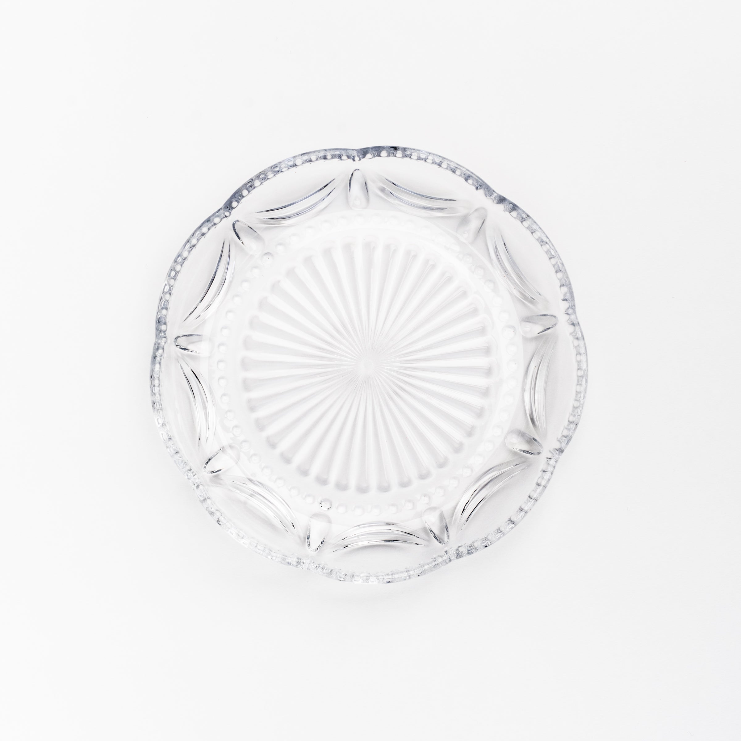 Pressed Glass Scalloped Plate on a white background at Addison West