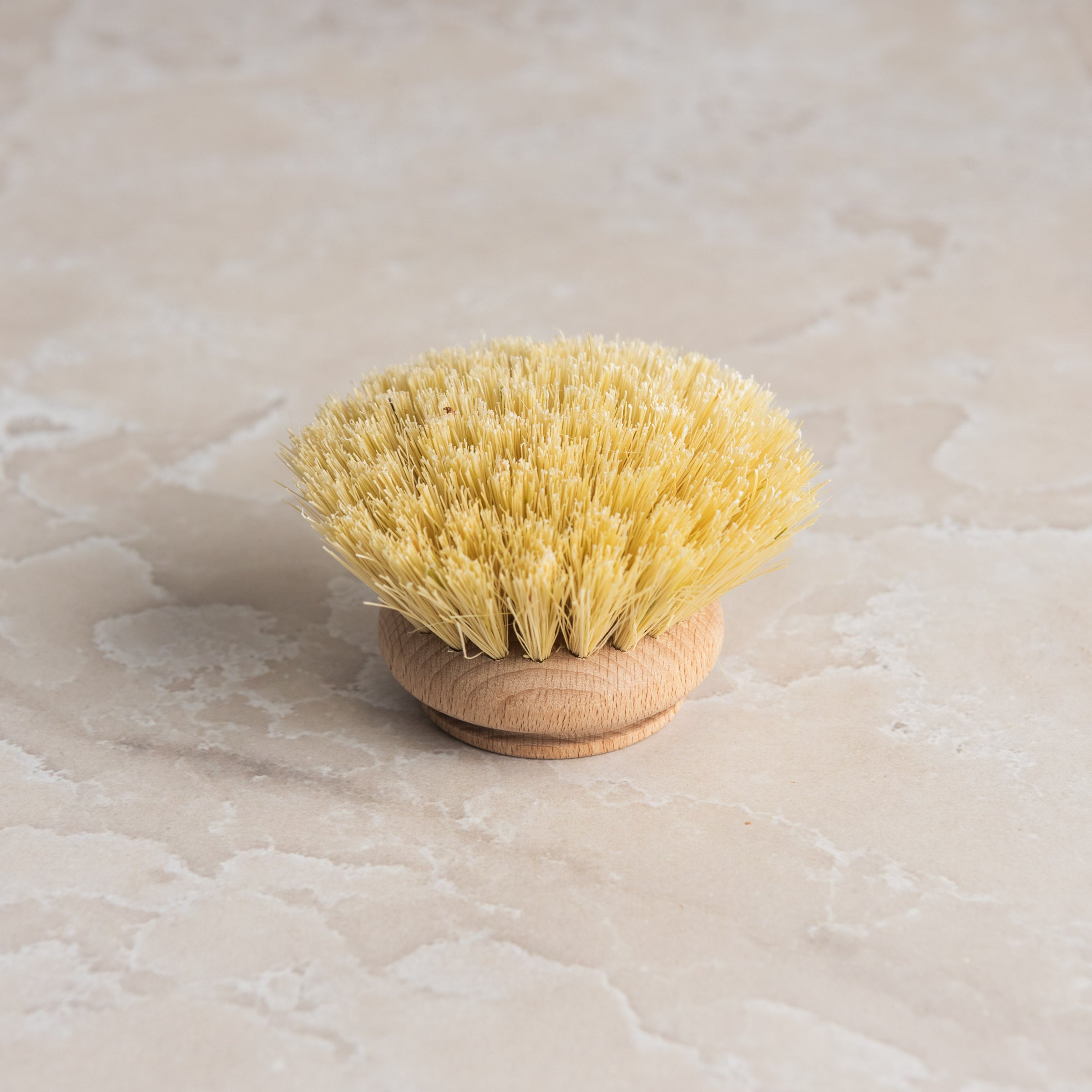 Redecker Natural Fiber Dish Brush Replacement Head on a marble table at Addison West