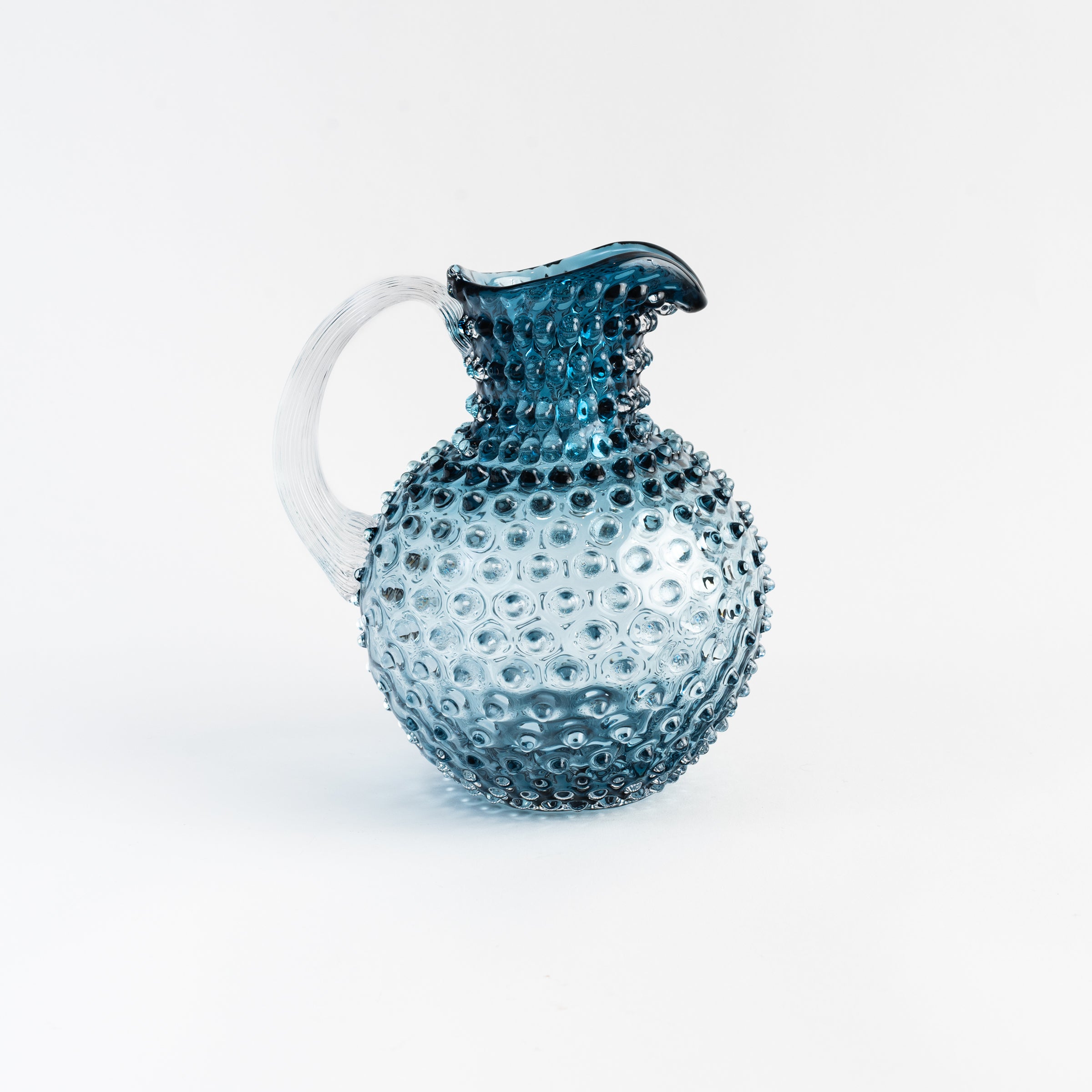 Blue Grey Hobnail Pitcher on a white background at Addison West