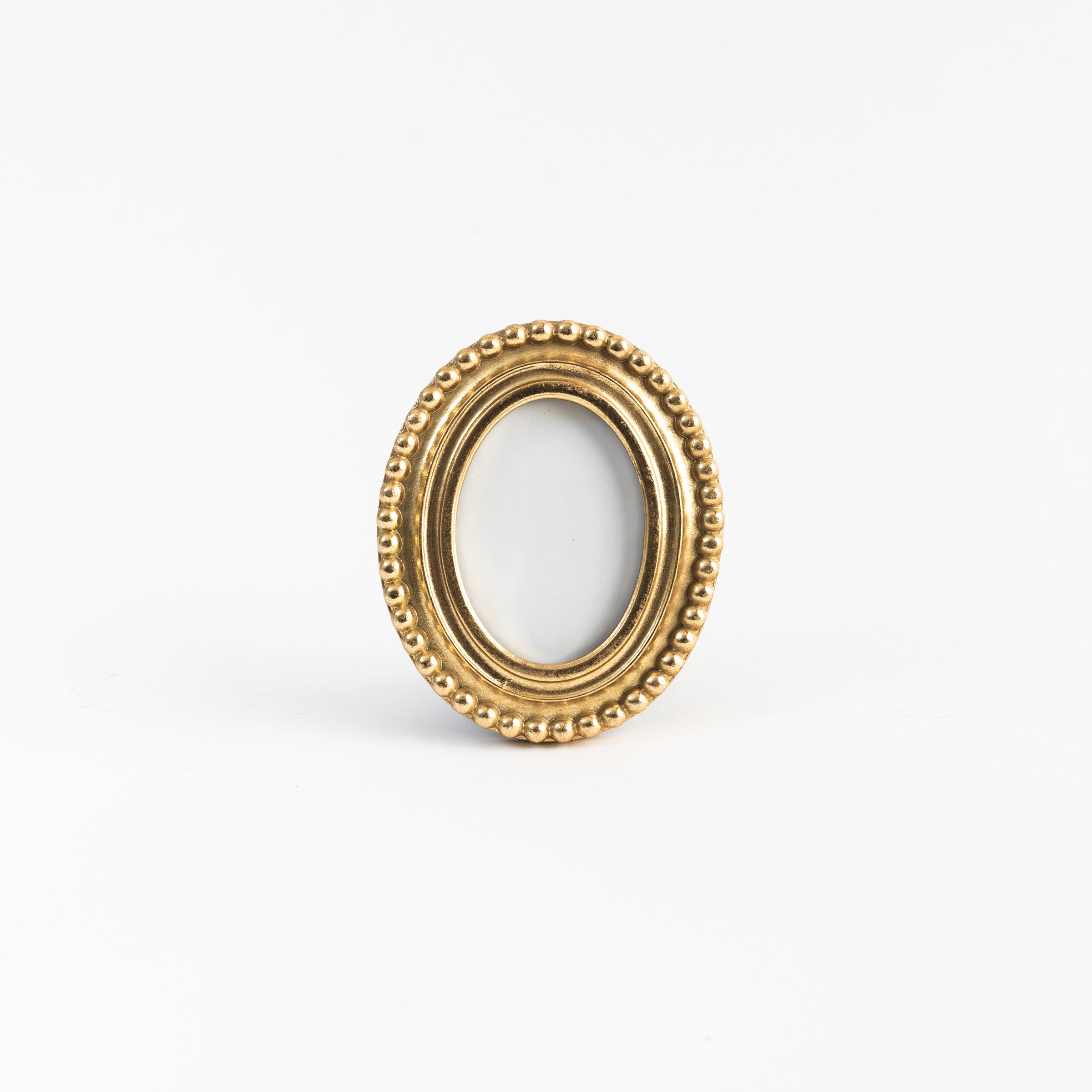 Oval Golden Beaded Picture Frame on a white background at Addison West