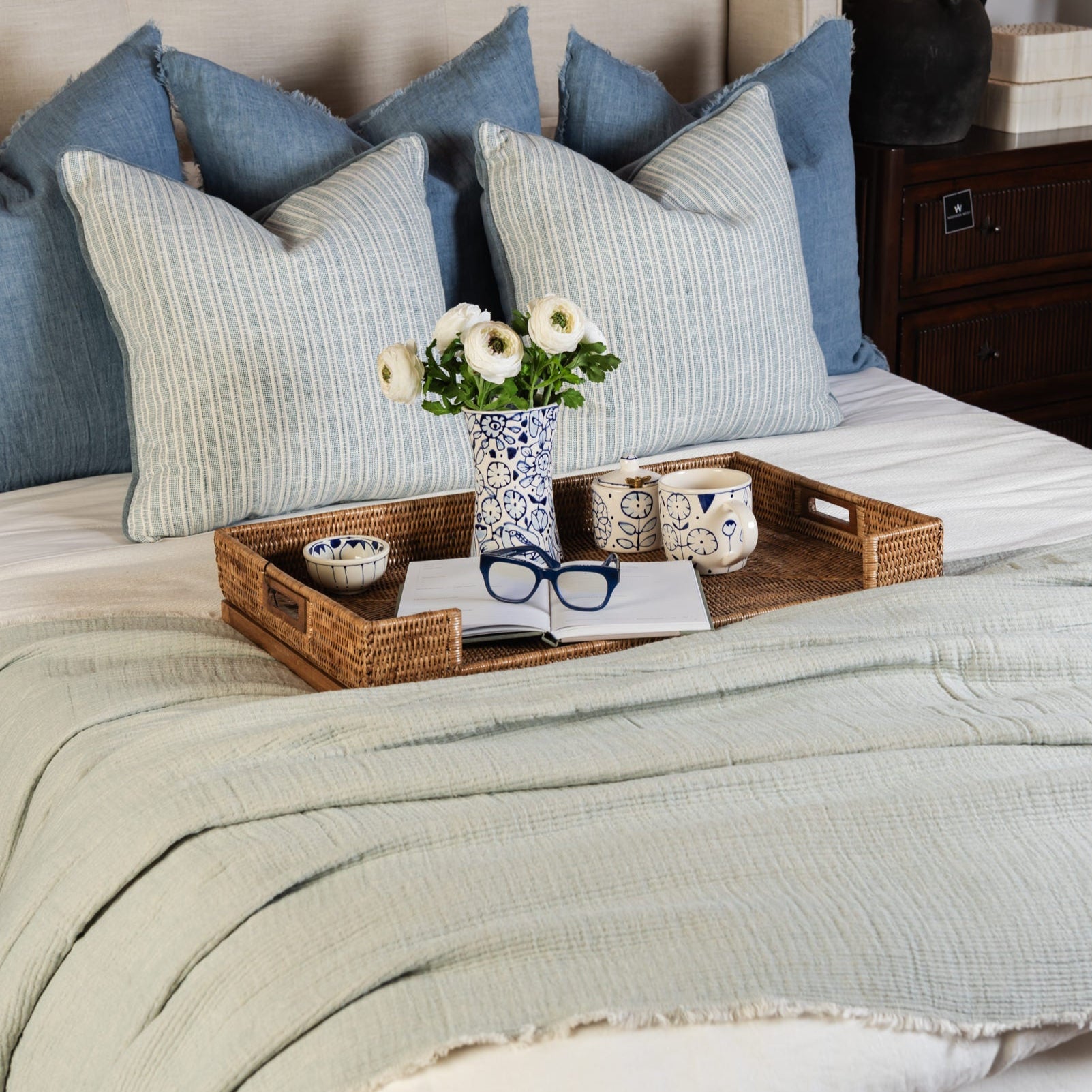 Burma Rattan Lap Tray Table on a bed at Addison West