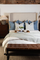 Madeira Double Sided Bed Blanket - Sky/Grey on a bed with a tray at Addison West