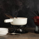 Vintage Fondue Plates and White on a wood table at Addison West 