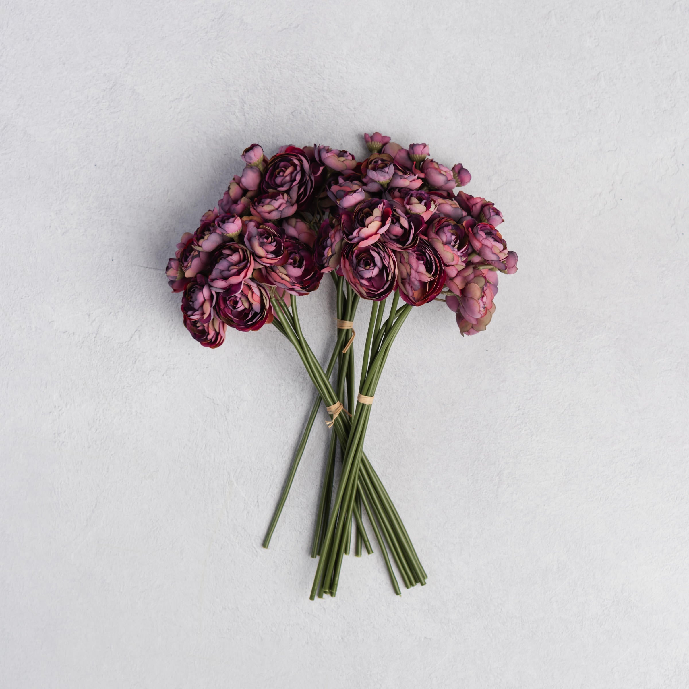 Abigail Ahern Faux Ranunculus Bunch in Purple on a white background at Addison West