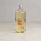 Lothantique 1L Liquid Soap Refill - Verbena on a marble table at Addison West