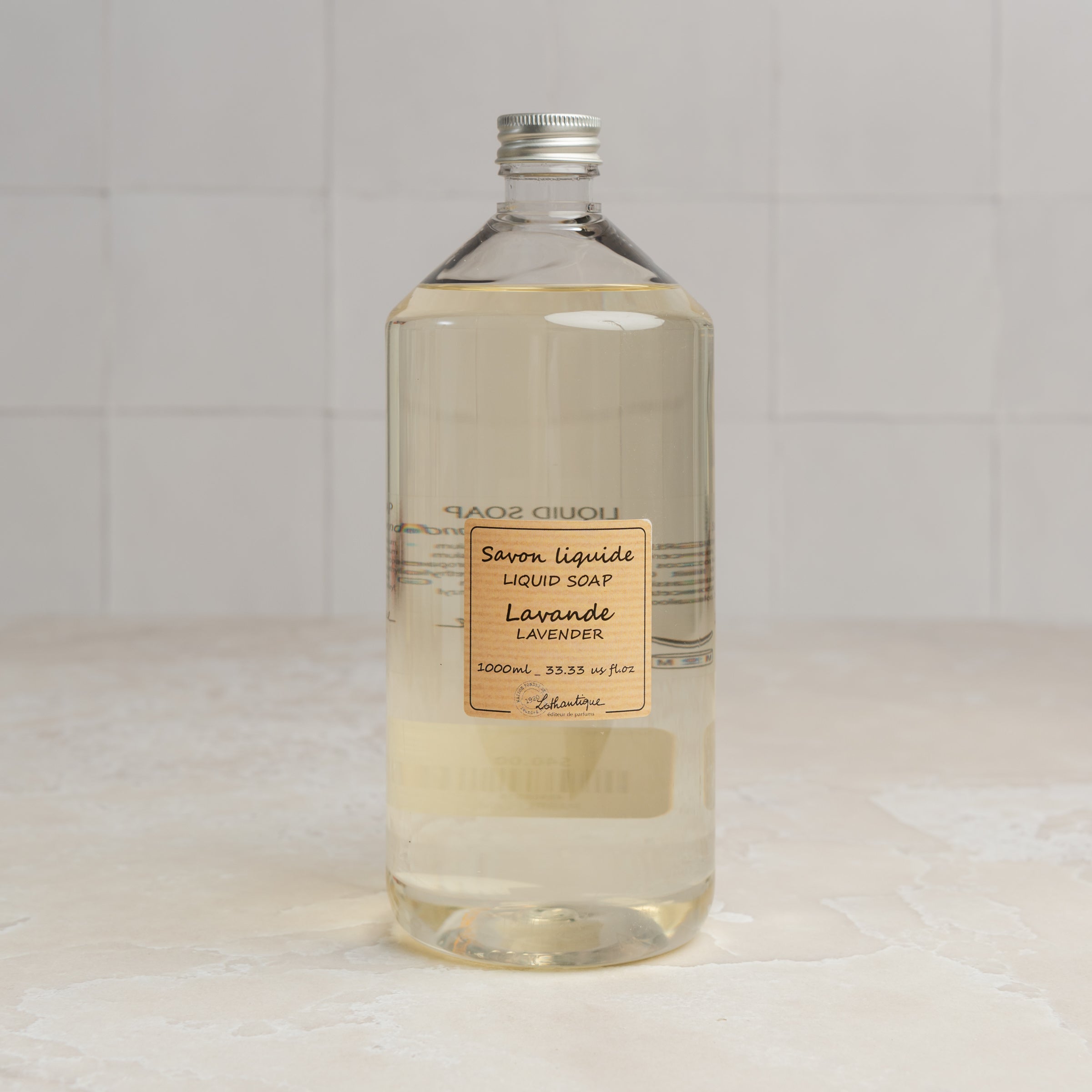 Lothantique 1L Liquid Soap Refill - Lavender on a marble table at Addison West