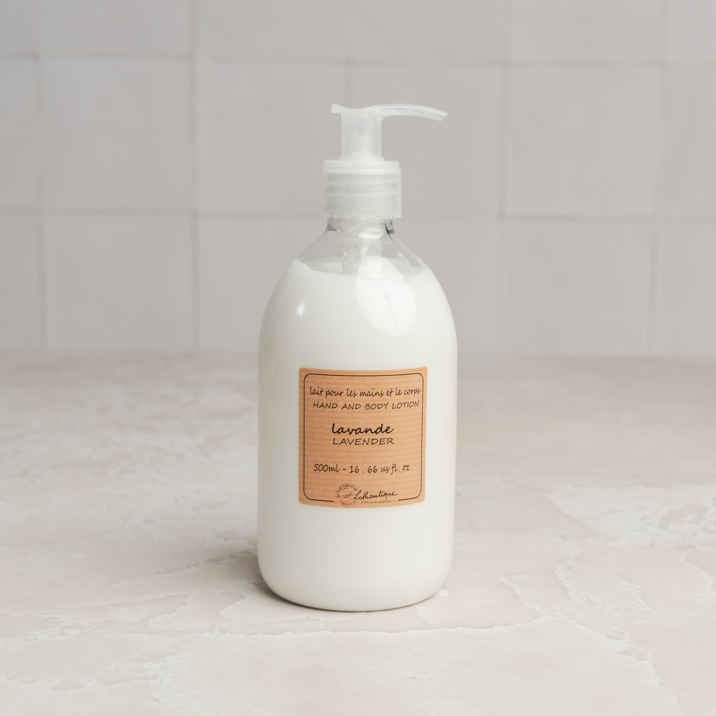 Lothantique Hand & Body Lotion - Lavender on a marble table at Addison West